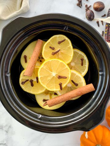Fall Potpourri Mix apples, lemons and spices in a mini slow cooker