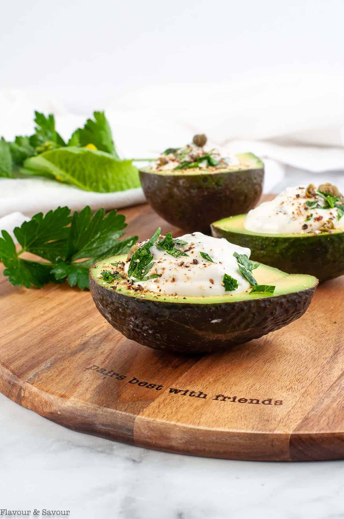 Stuffed Avocados with Creamy Herb Sour Cream Dip side view