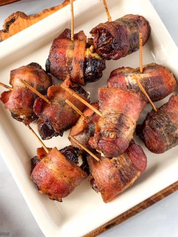 Close up view of stuffed dates wrapped in bacon