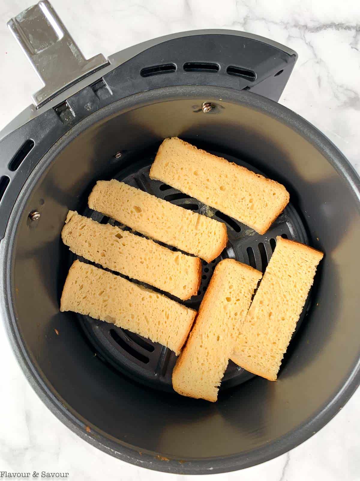 preparing air fried french toast sticks