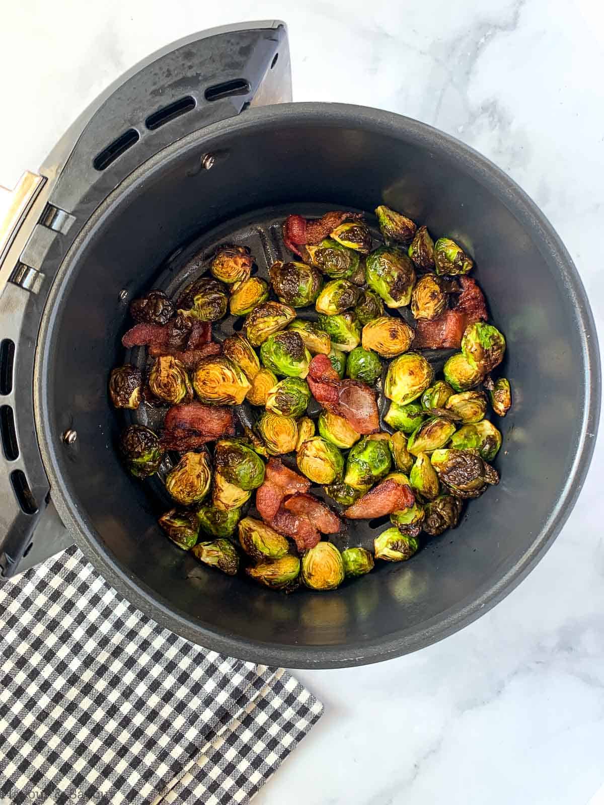 Cooked Brussels Sprouts in air fryer basket