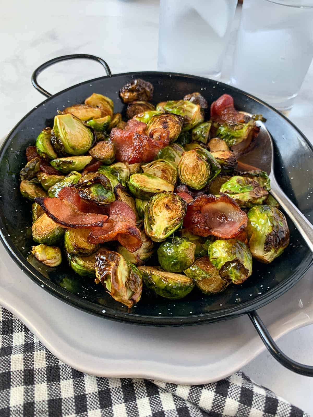 Balsamic Bacon Brussels Sprouts in a black serving dish