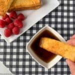 Dipping French Toast Stick in maple syrup