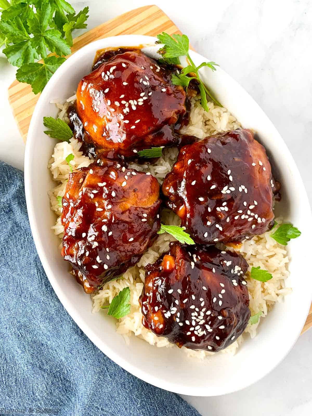 Overhead view of Instant Pot Chicken Thighs in an oval bowl