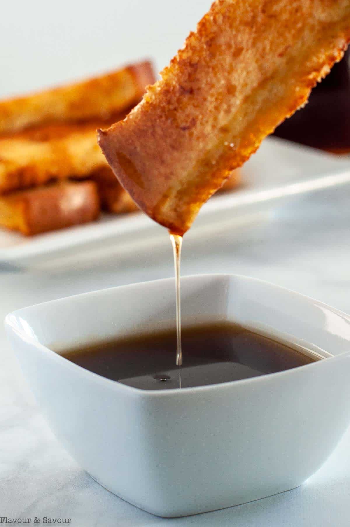 Maple syrup dripping from a French Toast stick