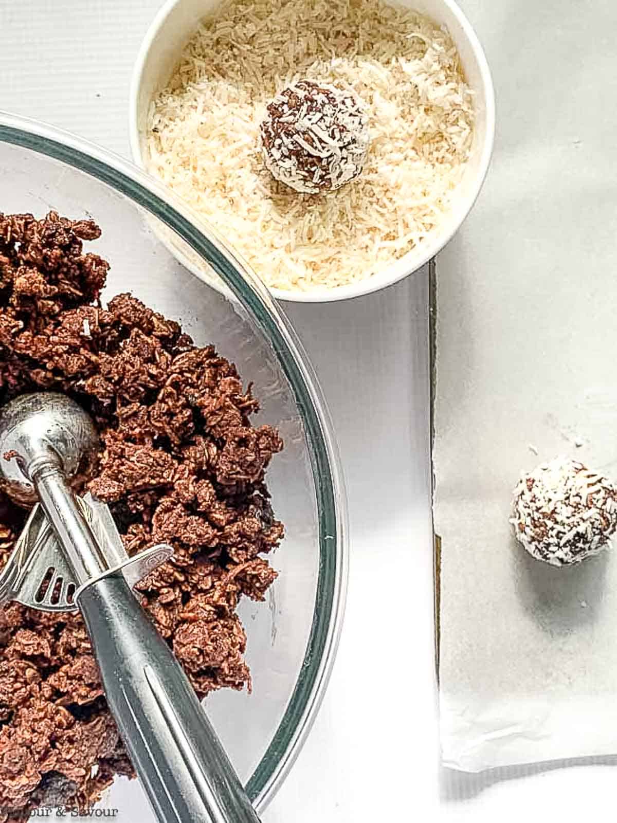 Rolling chocolate snowballs in coconut.