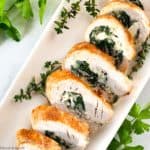 Sliced Stuffed Rolled Turkey on a serving platter