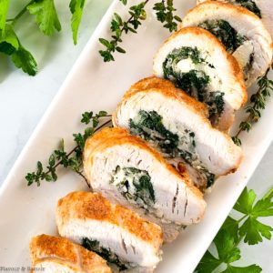 Sliced Stuffed Rolled Turkey on a serving platter