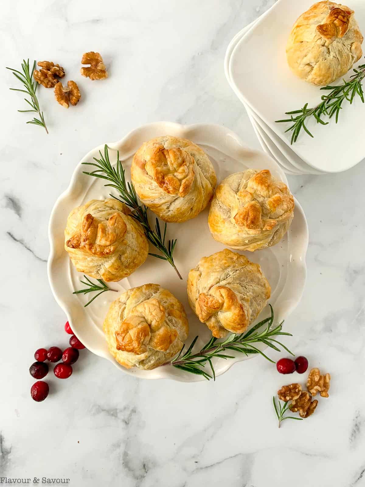 Overhead view of Cranberry Walnut Beggars' Purses with rosemary sprigs.