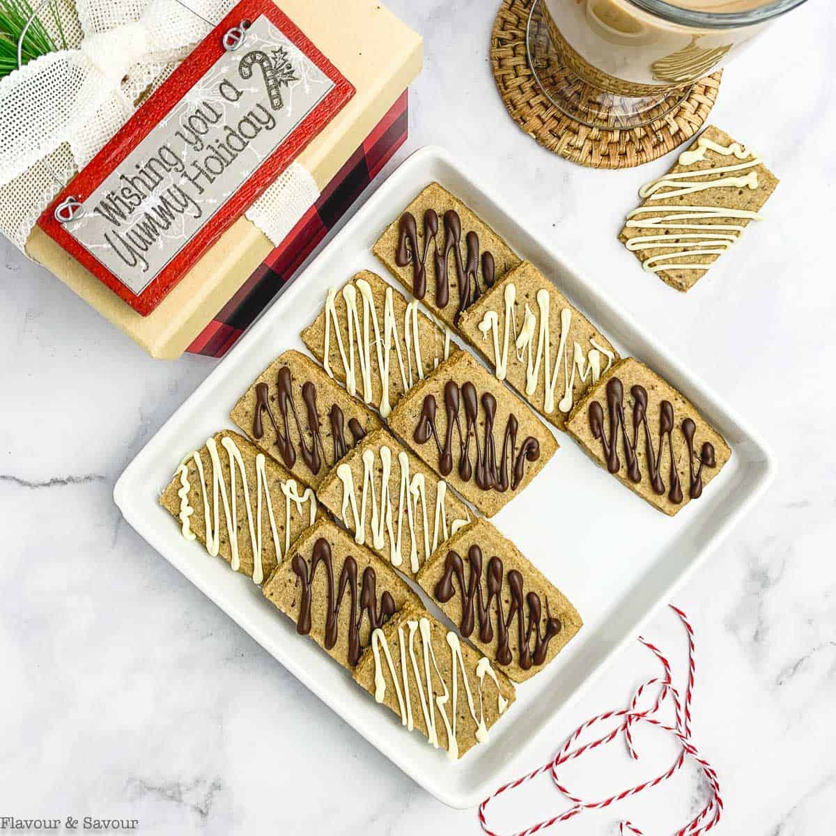 Overhead view of Grain-Free Espresso Almond Flour Shortbread Cookies drizzled with white and dark chocolate.