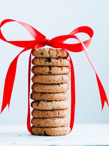 A stack or cookies tied with a red ribbon.
