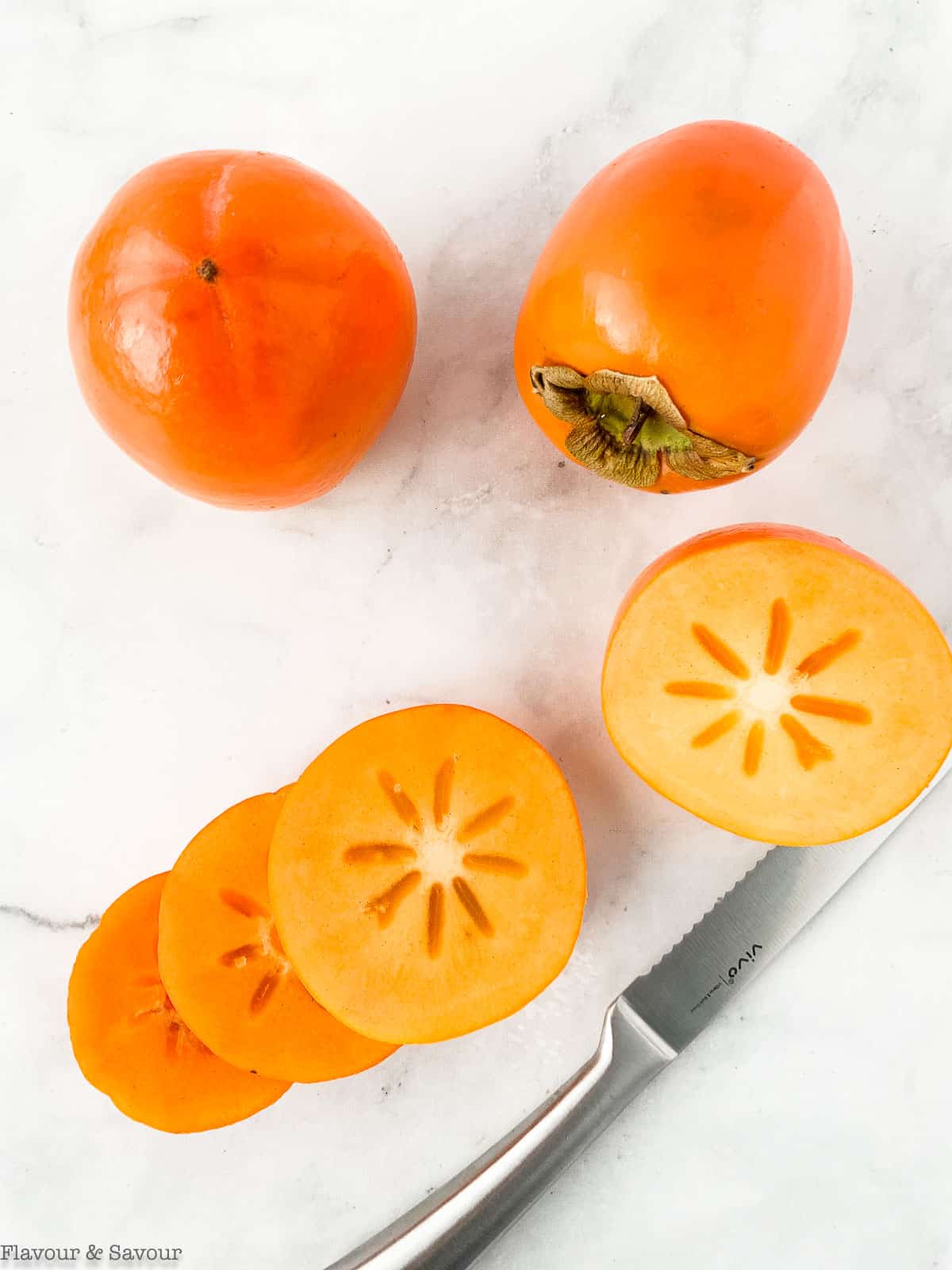 Hachiya persimmons, whole and sliced