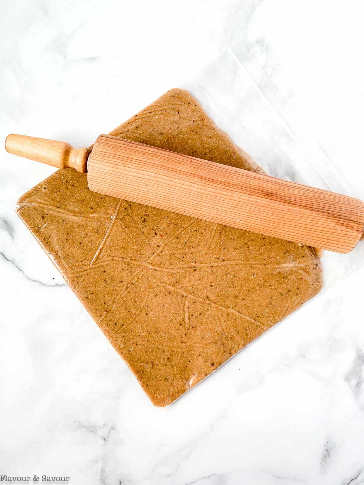 Rolling dough inside a ziplock bag for Espresso Shortbread