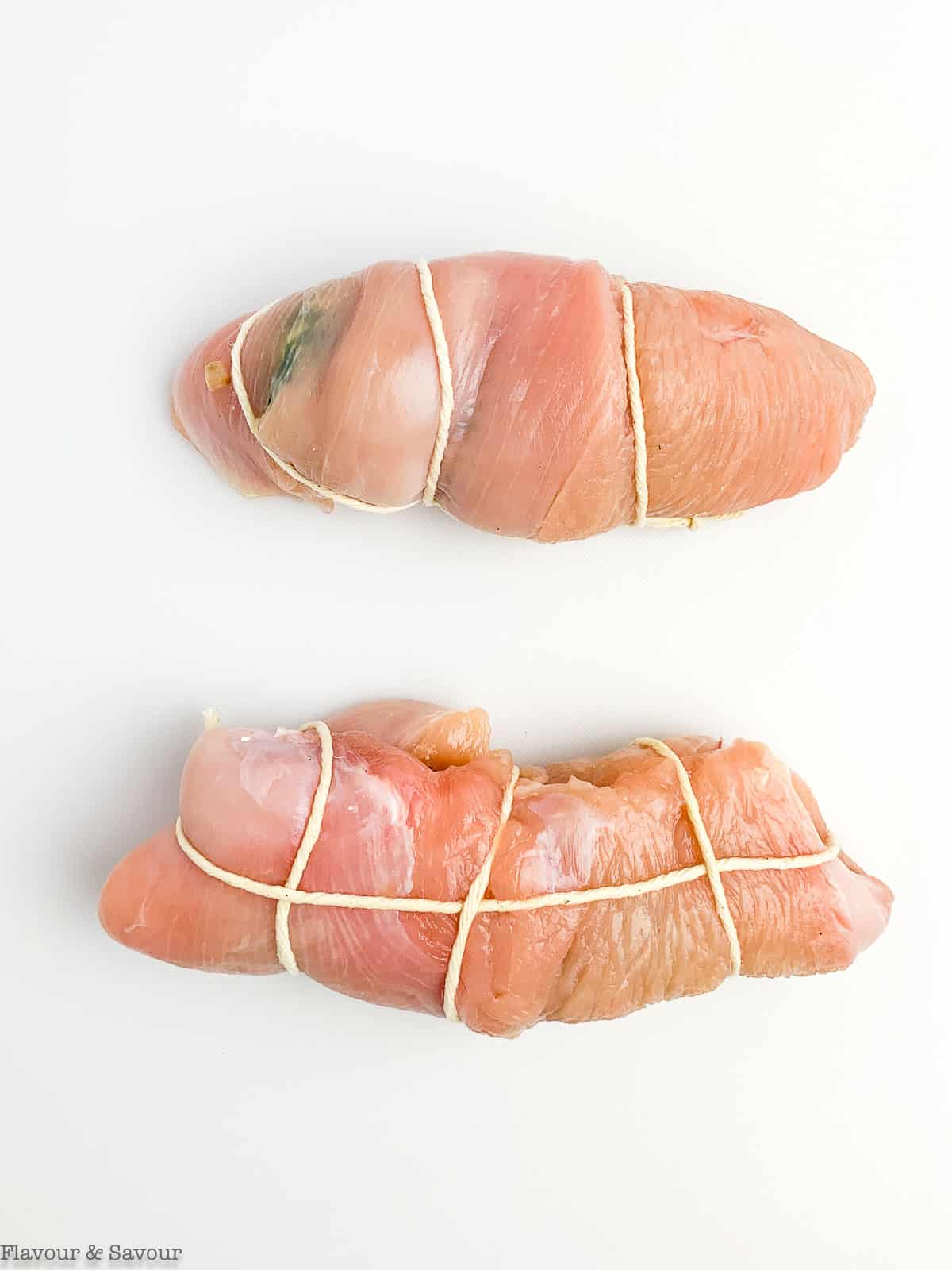 Rolled and tied stuffed rolled turkey breasts.