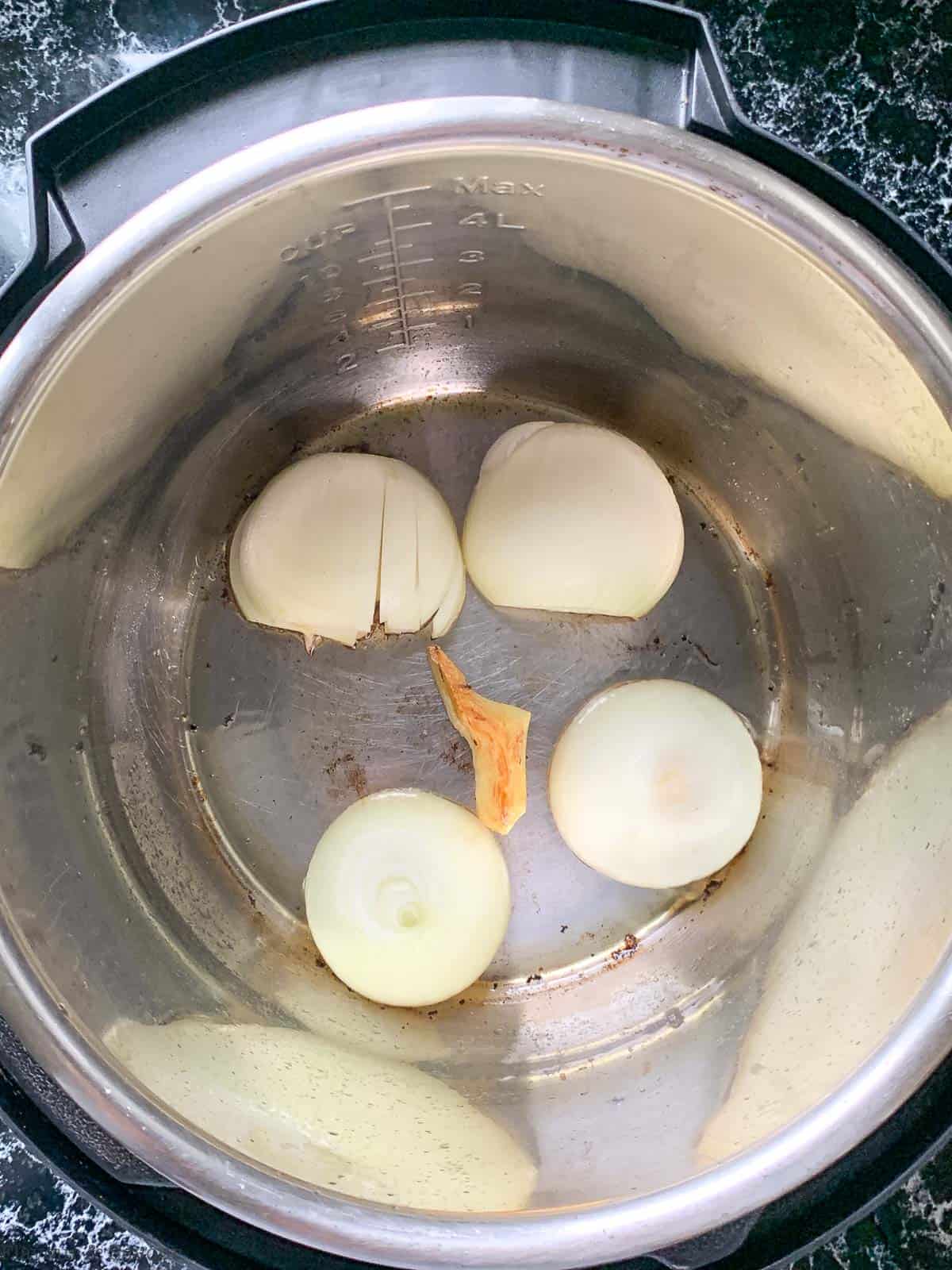Charring onions and ginger in an Instant pot.