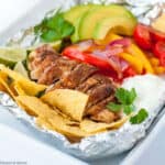 cooked chicken breast fajitas in foil packet