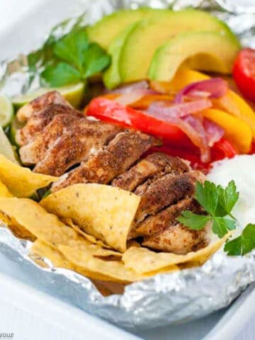 cooked chicken breast fajitas in foil packet