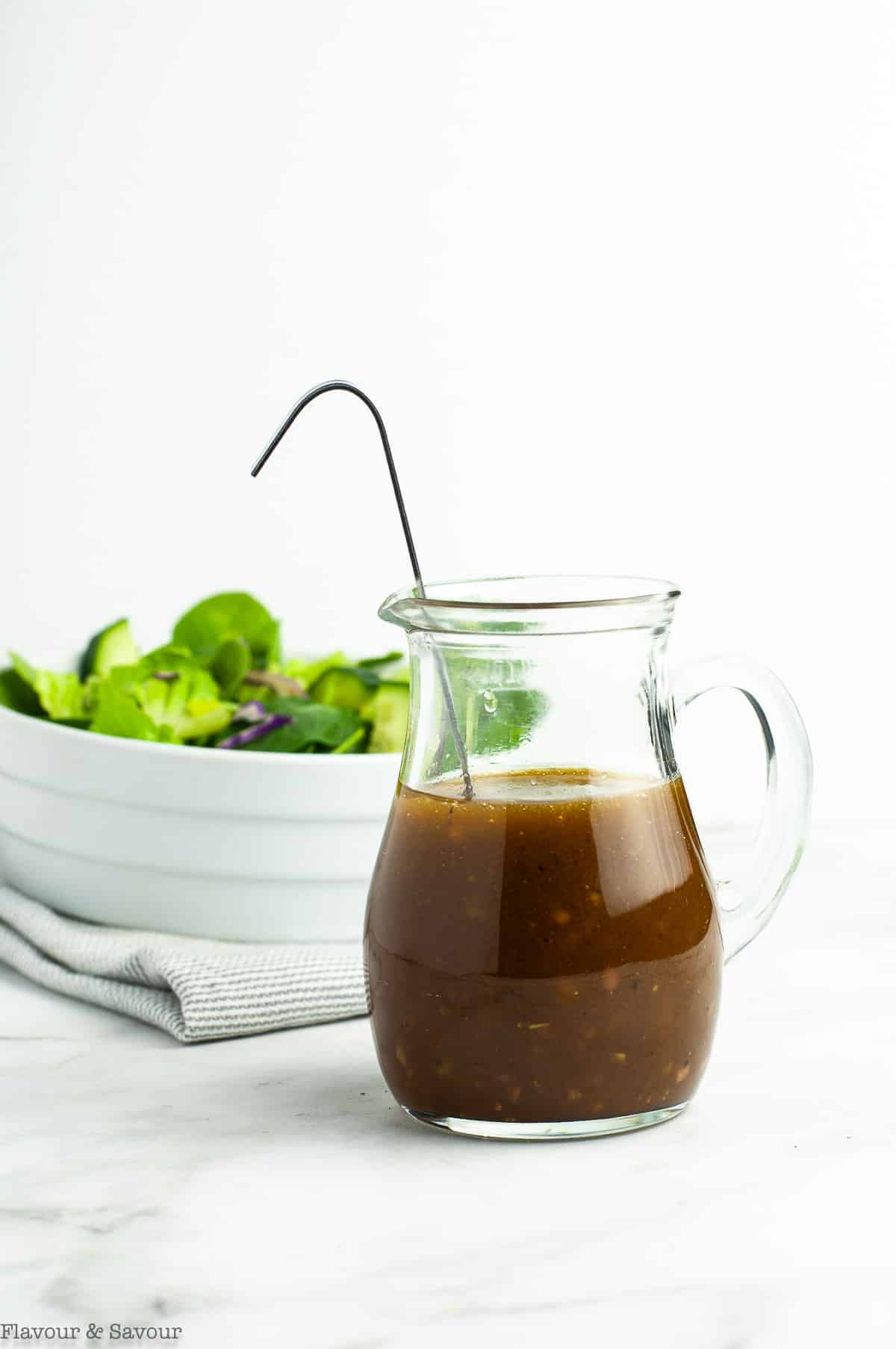 Easy Maple Balsamic Dressing in a small glass pitcher