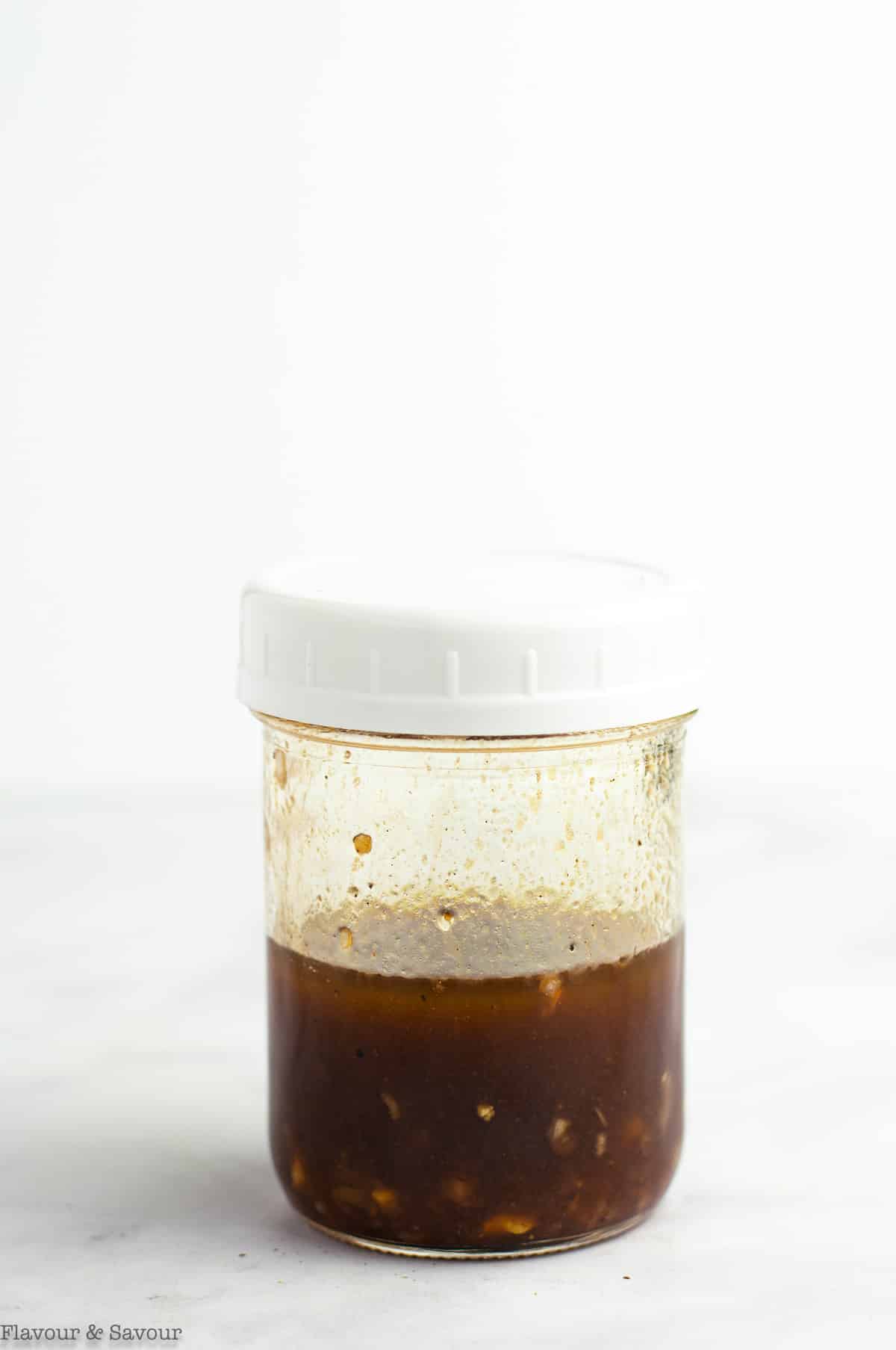 Maple balsamic dressing in a jar.
