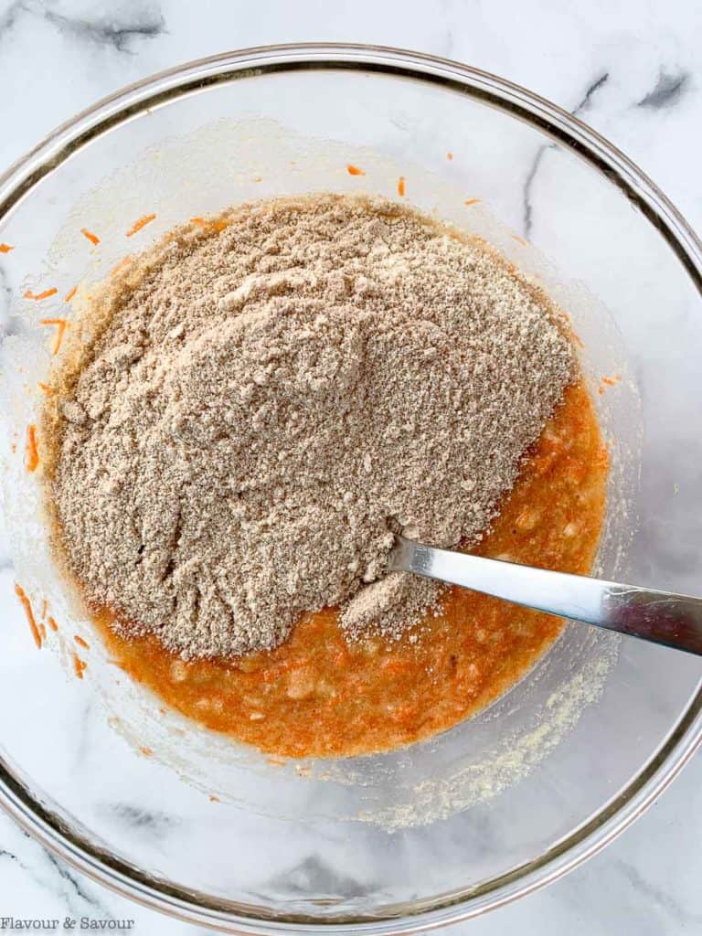 add dry ingredients to wet ingredients for carrot cake