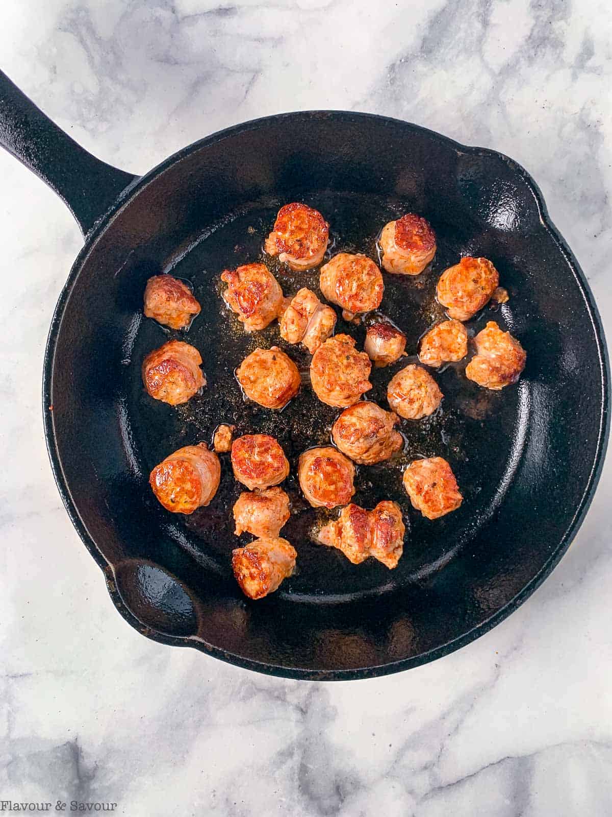 Browned sausage in cast iron skillet