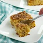 Square image of a slice of grain free banana coffee cake with a fork