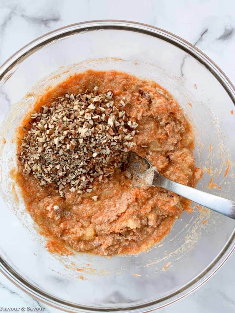 adding optional pecans to carrot cake batter