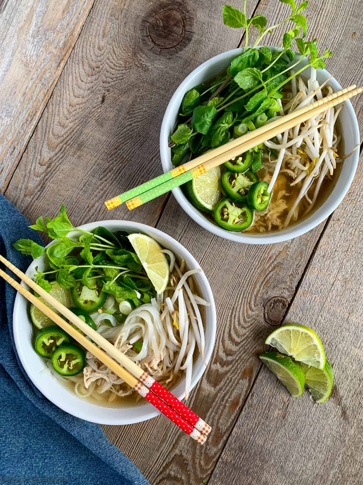 Two bowls of Chicken Pho (Pho Ga) also known as Vietnamese Chicken Noodle Soup
