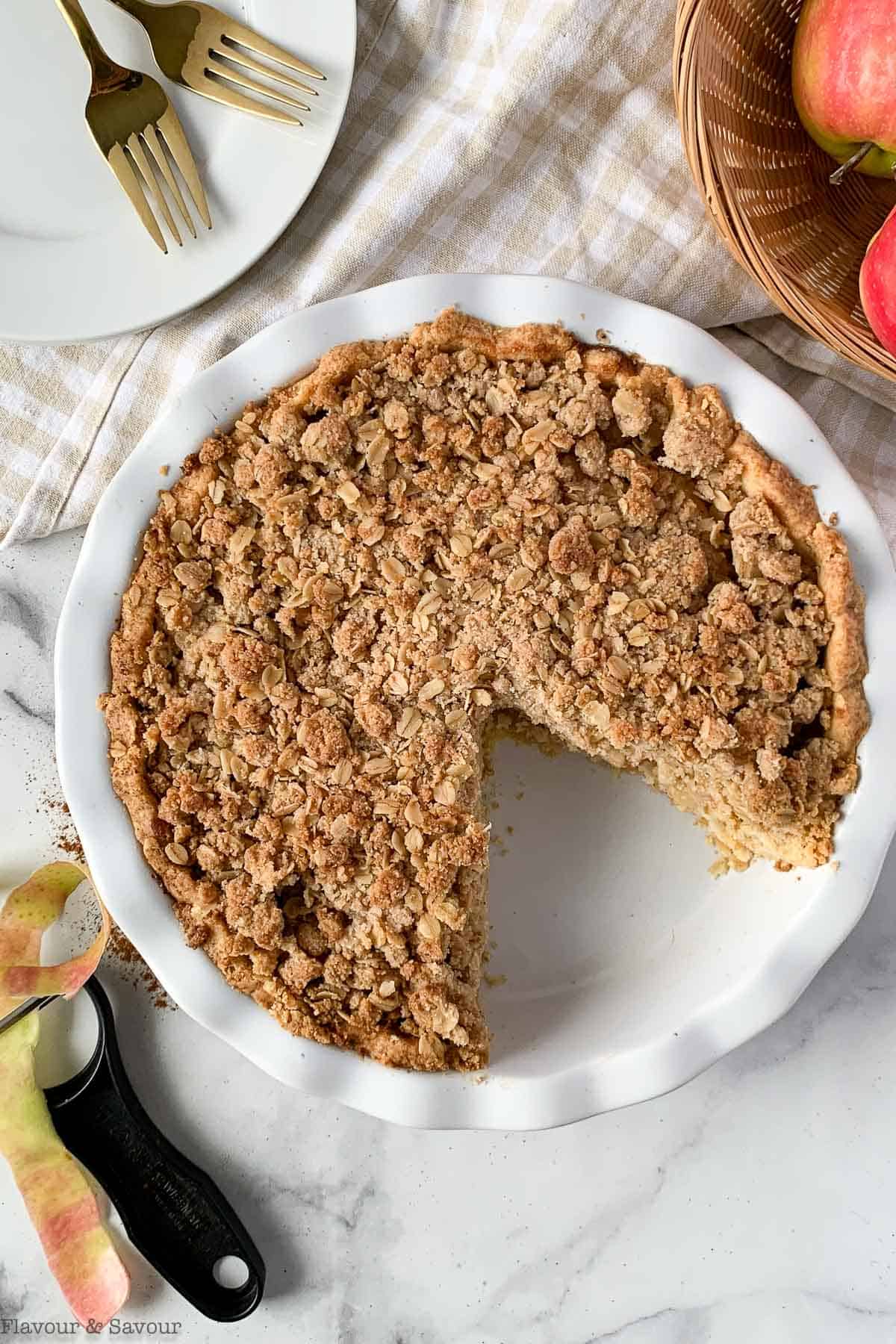 Gluten-Free Dutch Apple Pie in a pie plate with one slice removed.
