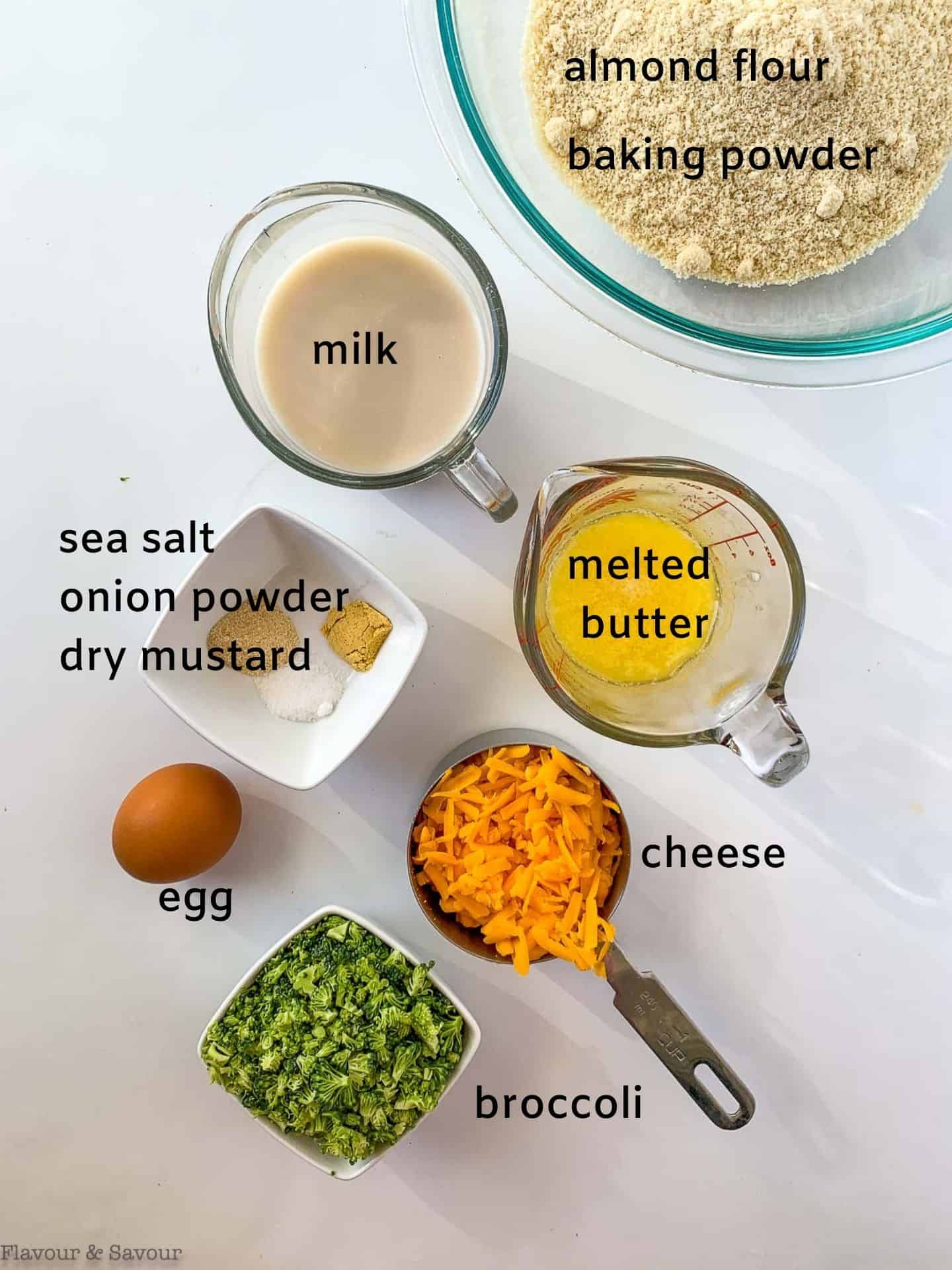 Ingredients with labels for mini gluten-free broccoli cheese muffins