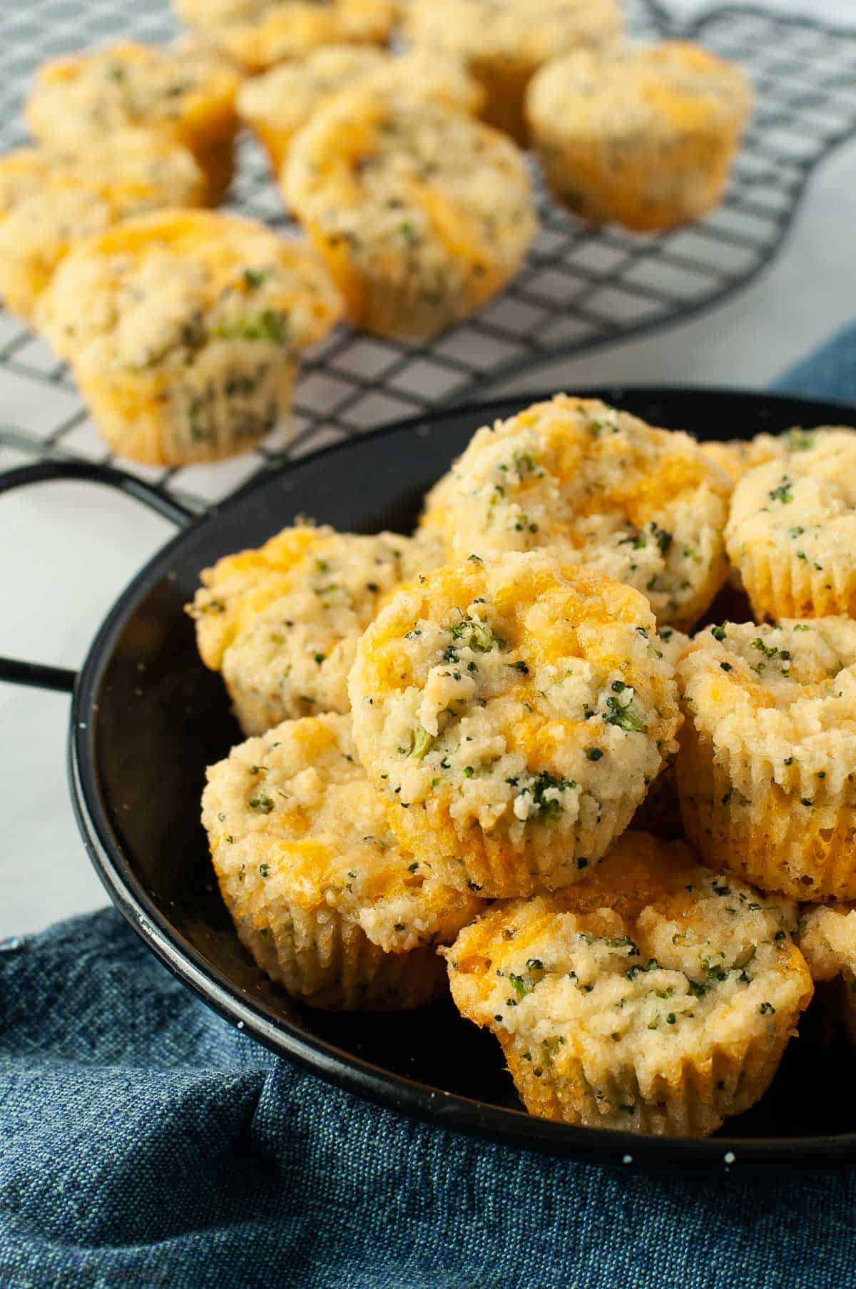 Overhead view of a bowl of broccoli cheddar muffins