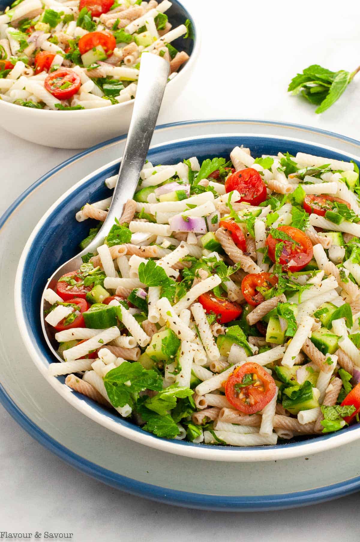 Close up view of a bowl of tabouli pasta salad