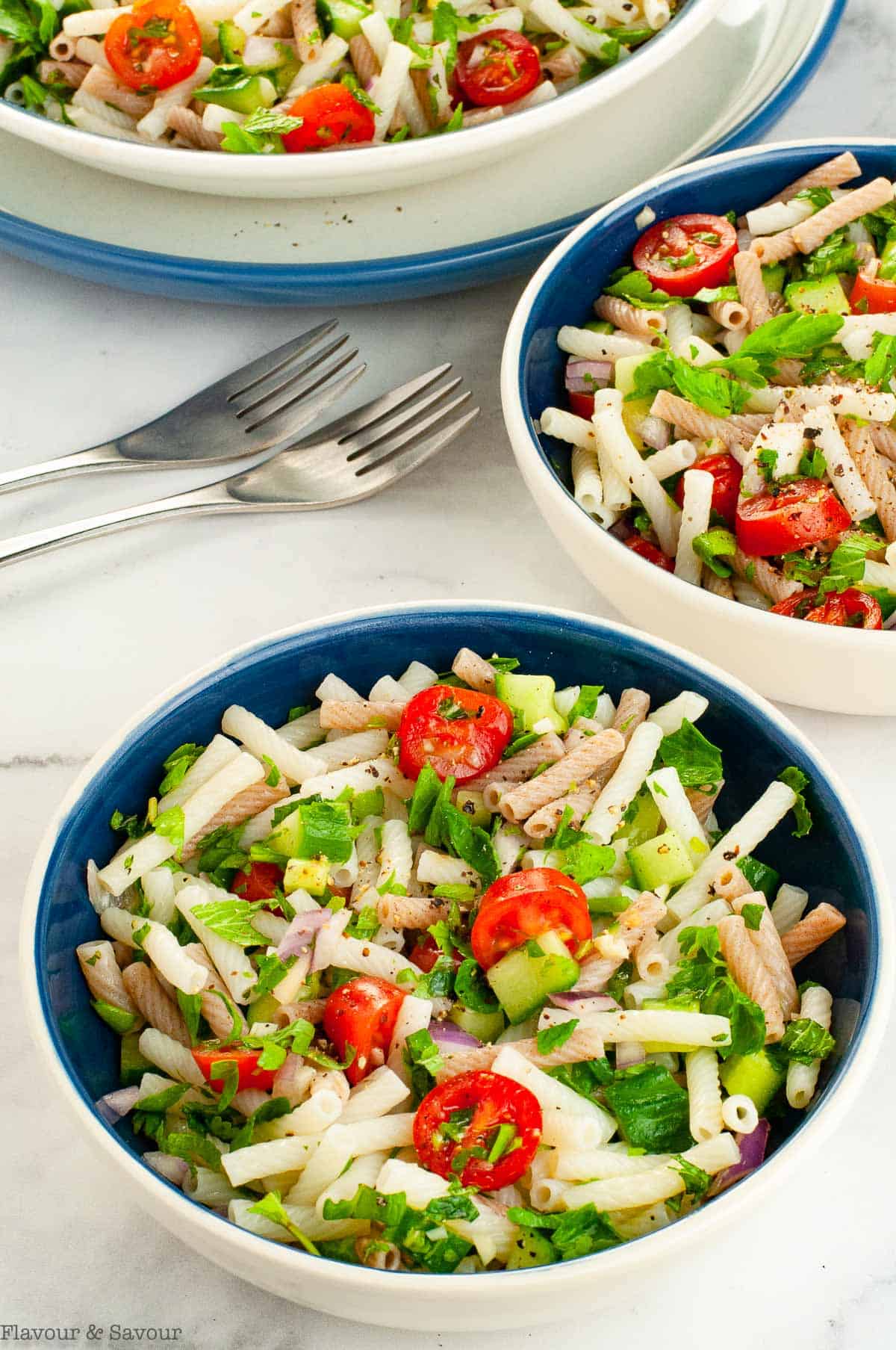 Tabouli Pasta Salad in three bowls.