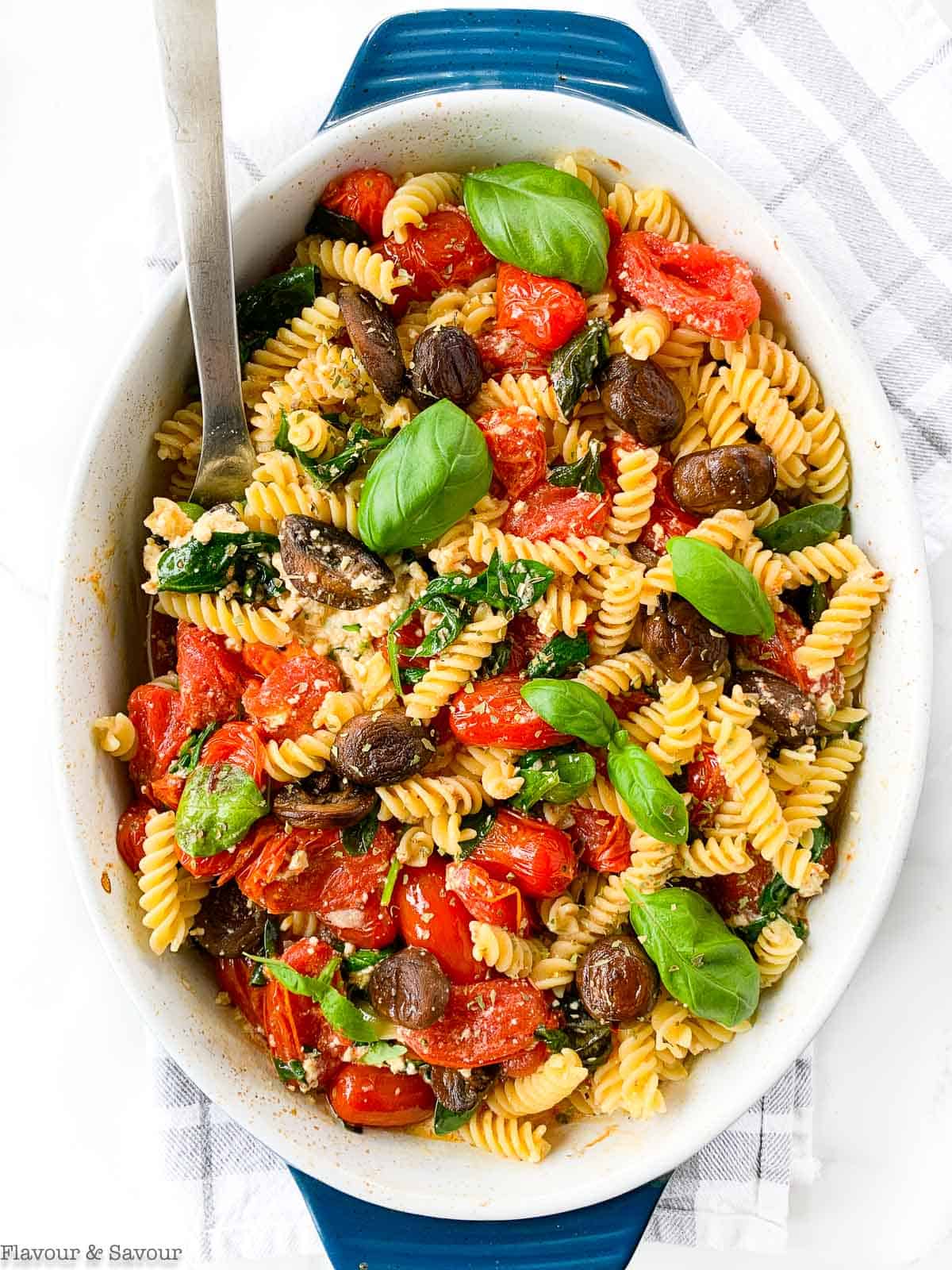 Gluten Free Feta Tomato Pasta Bake in a casserole dish