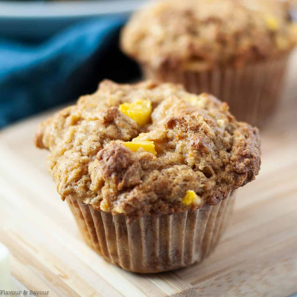 Close up view of a single Gluten-Free Mango Coconut Muffin