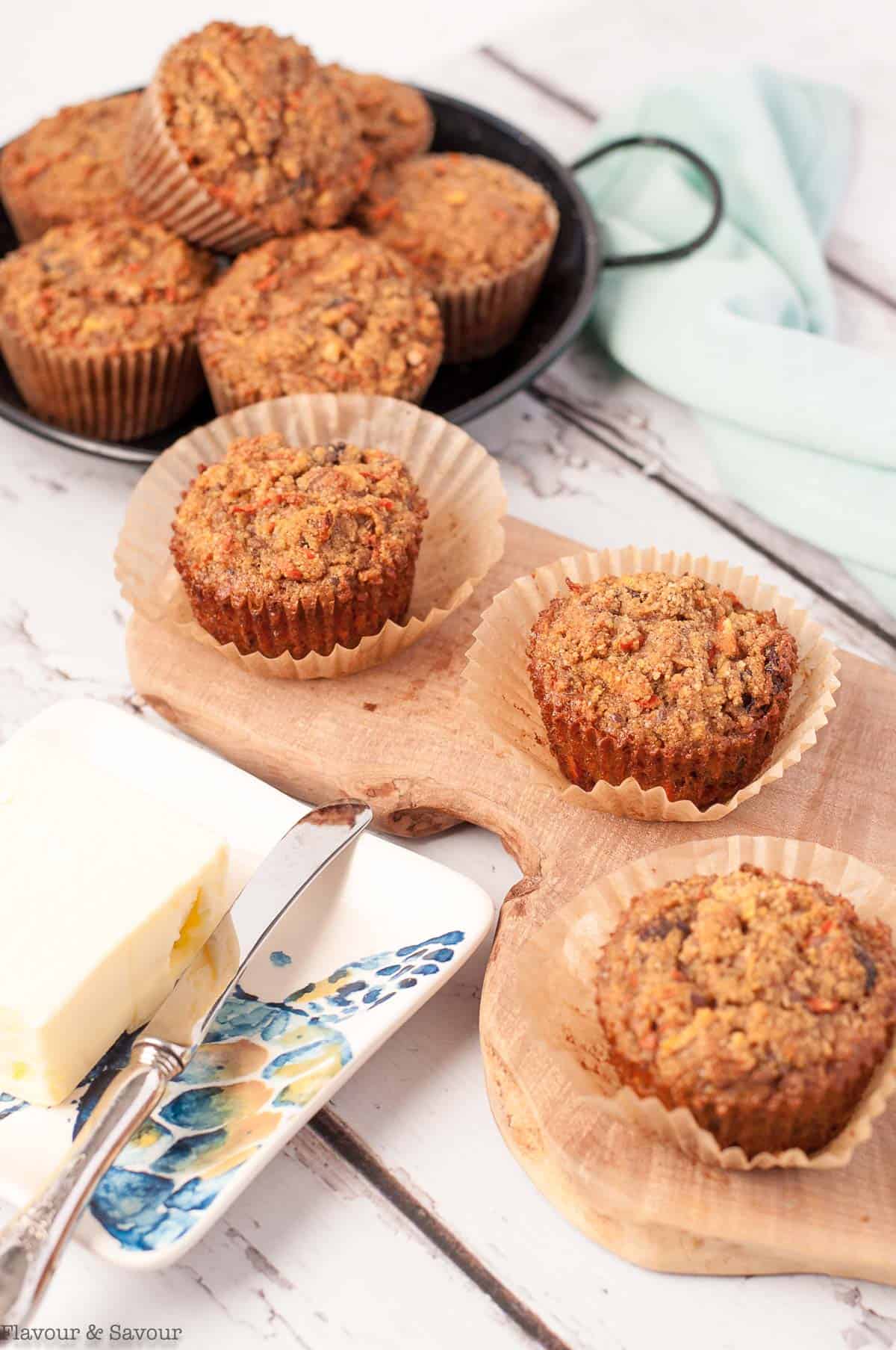 Gluten-free Sunshine Muffins on a board with butter