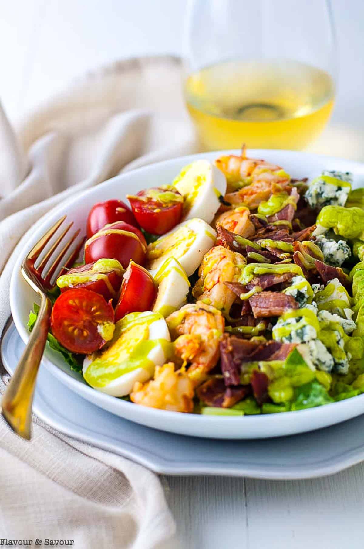 Lemon Garlic Shrimp Cobb Salad in a bowl with a fork.