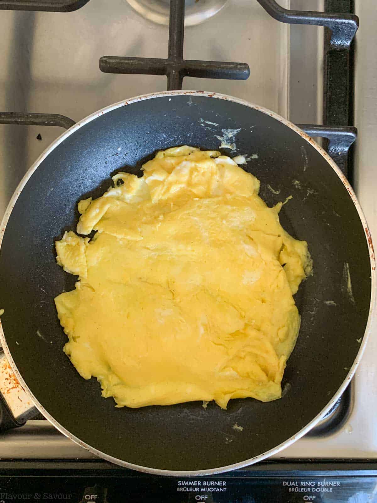 a thin omelet in a skillet for Nasi Goreng