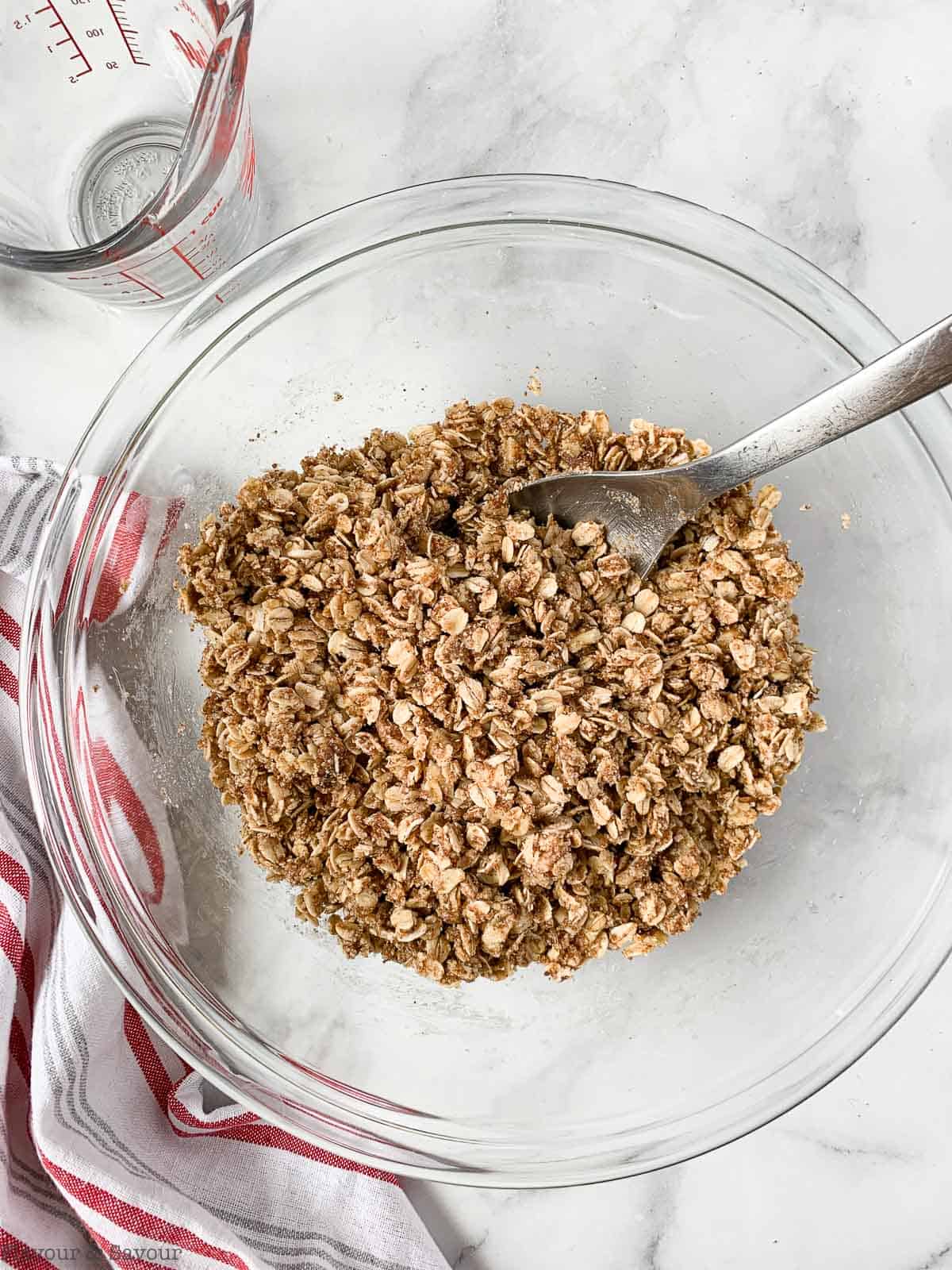 crumble topping for rhubarb crisp in a glass bowl.