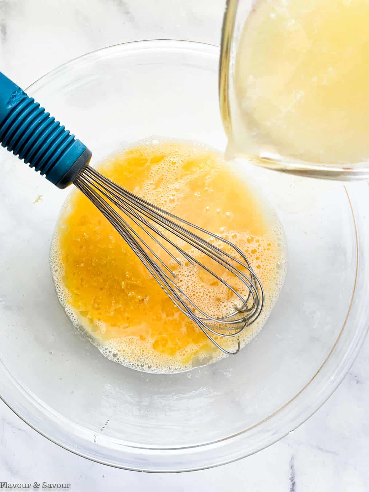 adding lemon juice to bowl