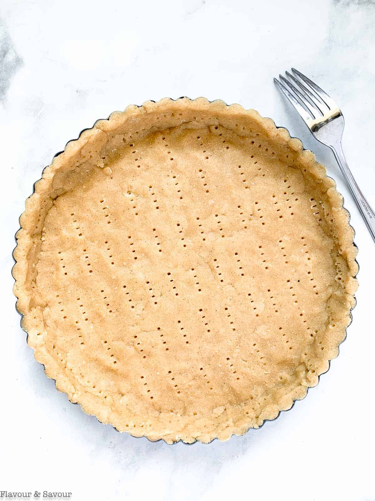 almond flour pie crust pricked with a fork