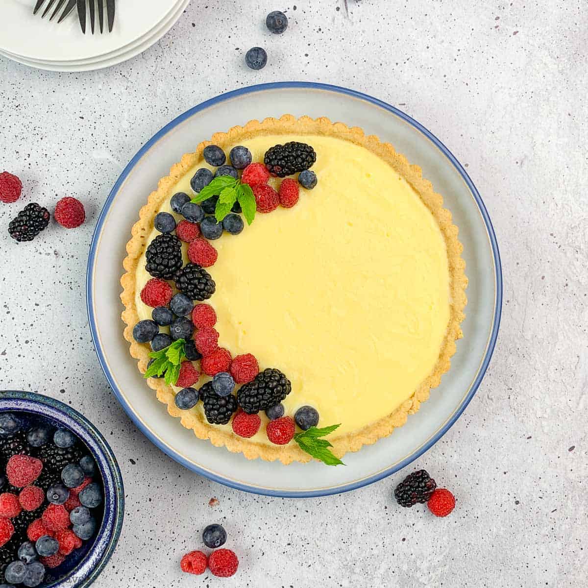 lemon curd tart in a round pan