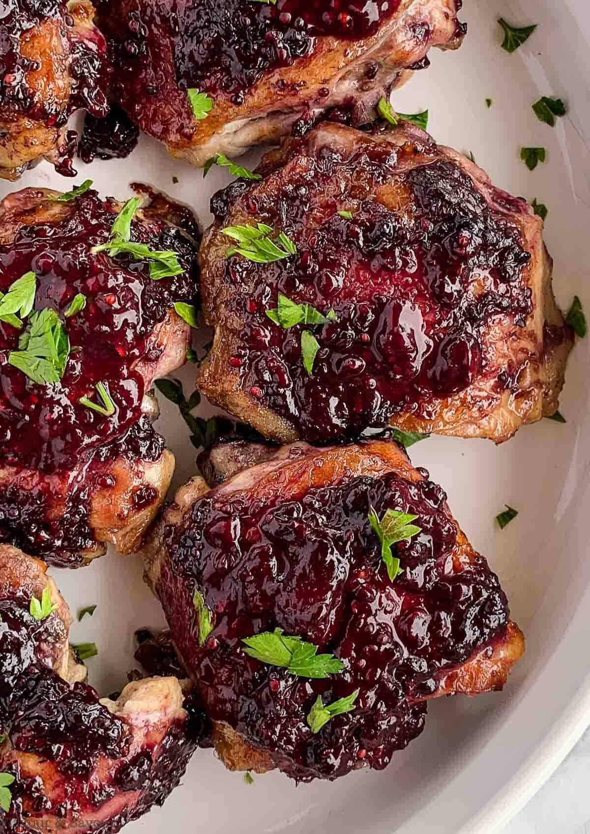 Close-up view of Blackberry Glazed Chicken Thighs.