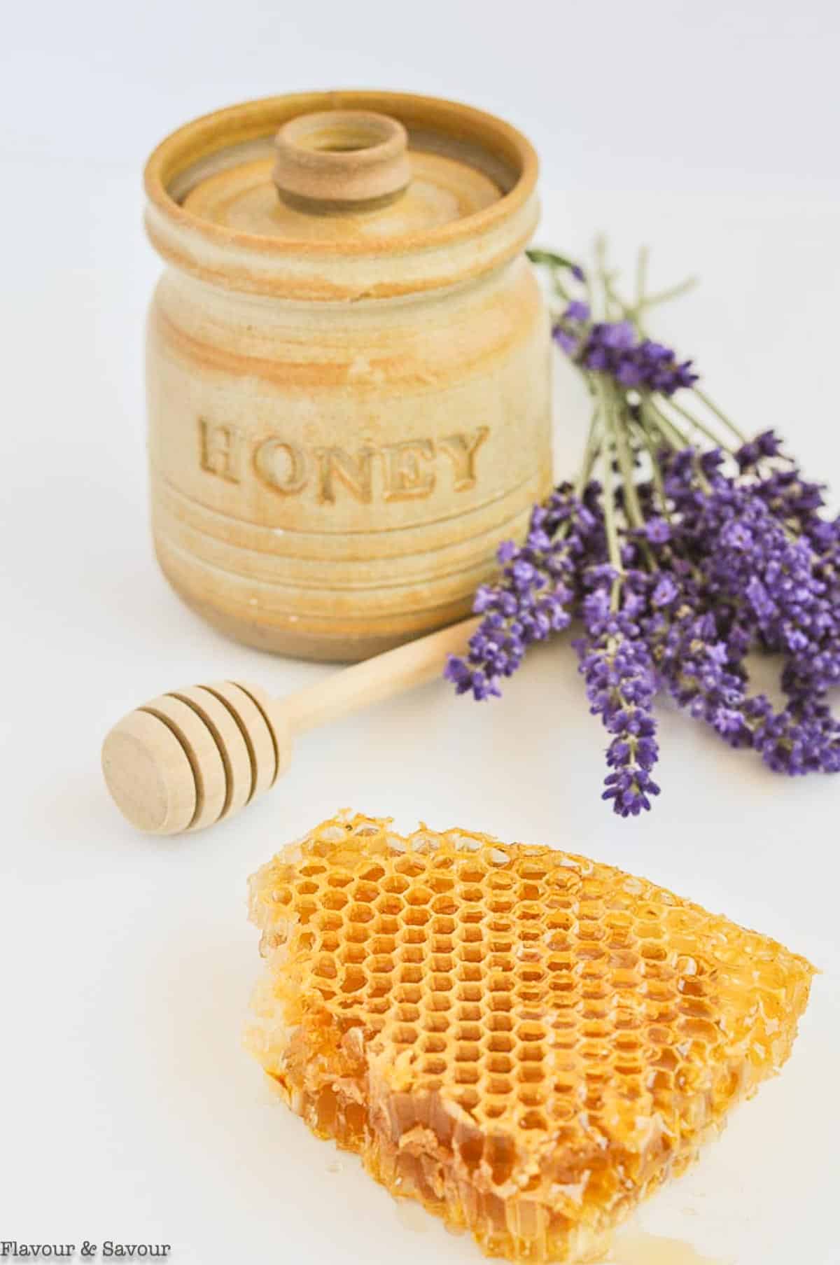 A honey pot, fresh lavender and honeycomb.