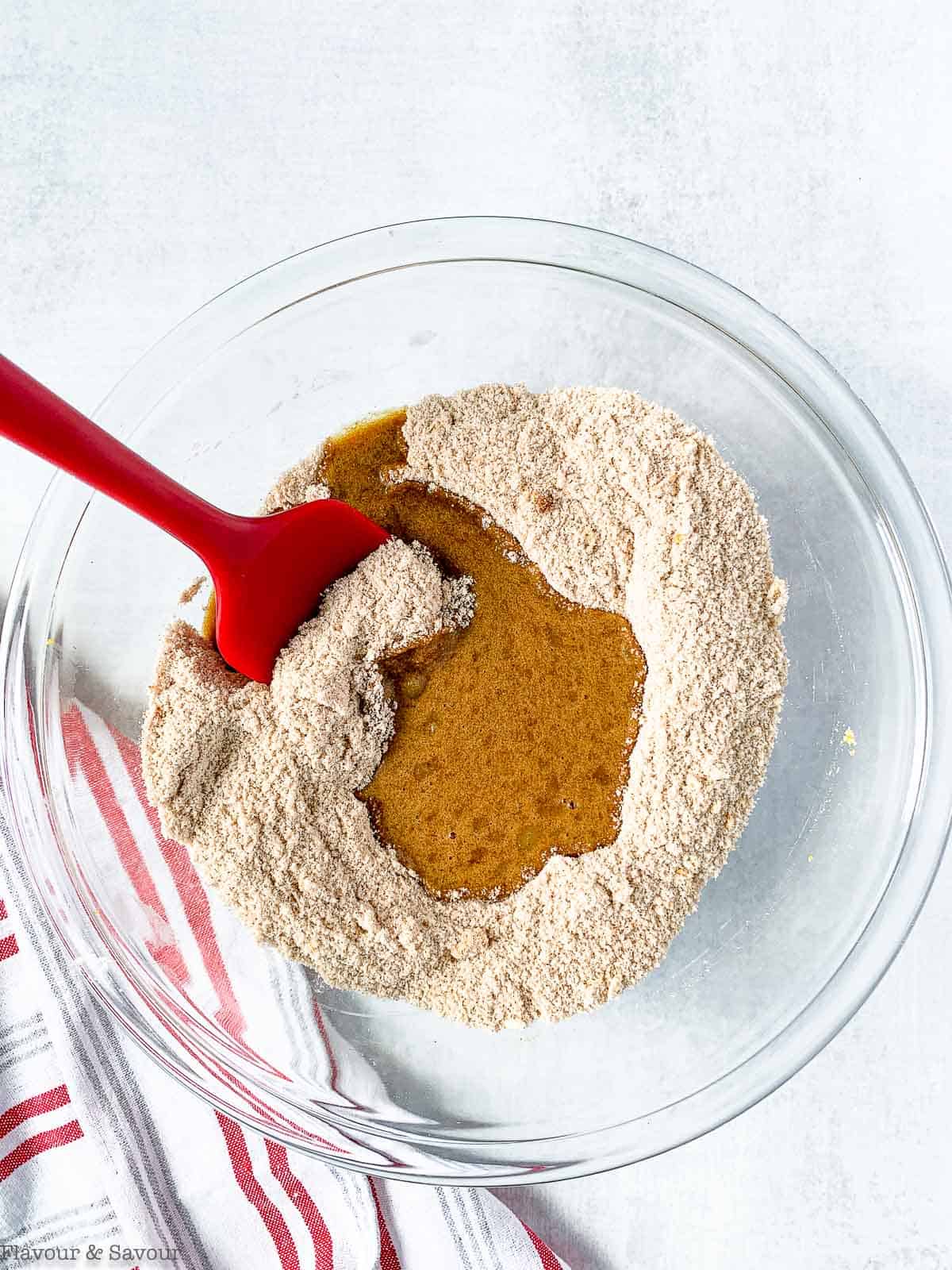 combining wet and dry ingredients for rhubarb muffins