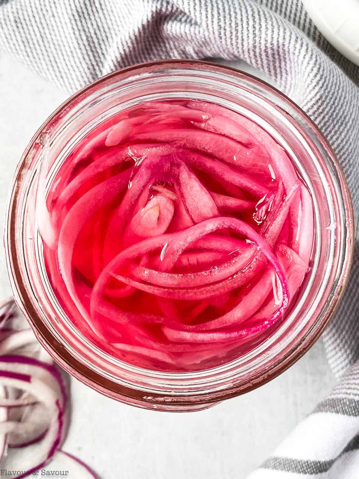 Overhead view of a jar of refrigerator pickled red onions