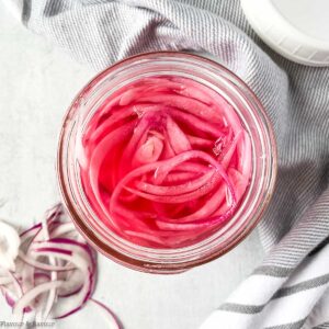 Overhead view of a Mason jar of quick refrigerator pickled red onions