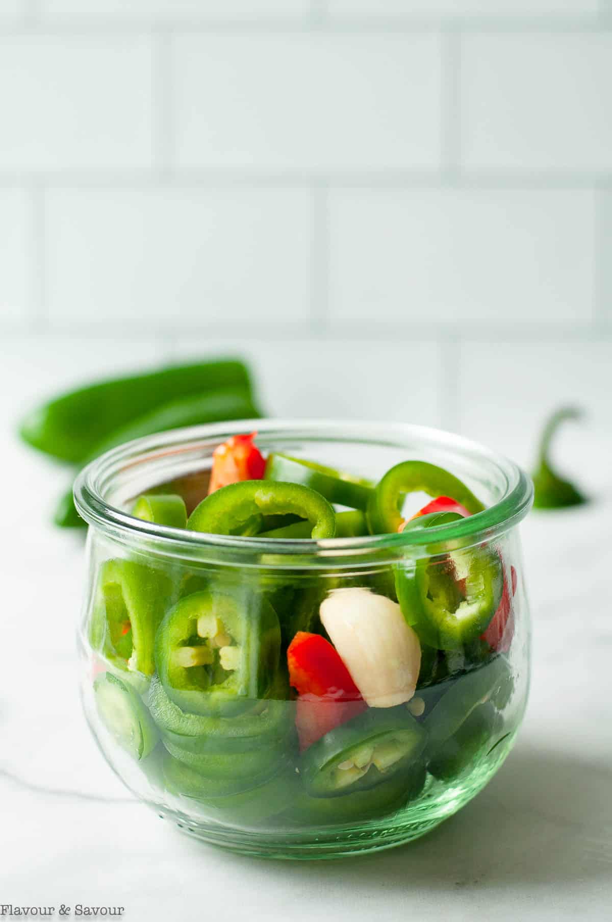 Sliced jalapeño peppers in a Weck jar.