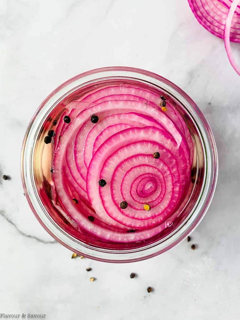Overhead view of a jar of pickled red onions
