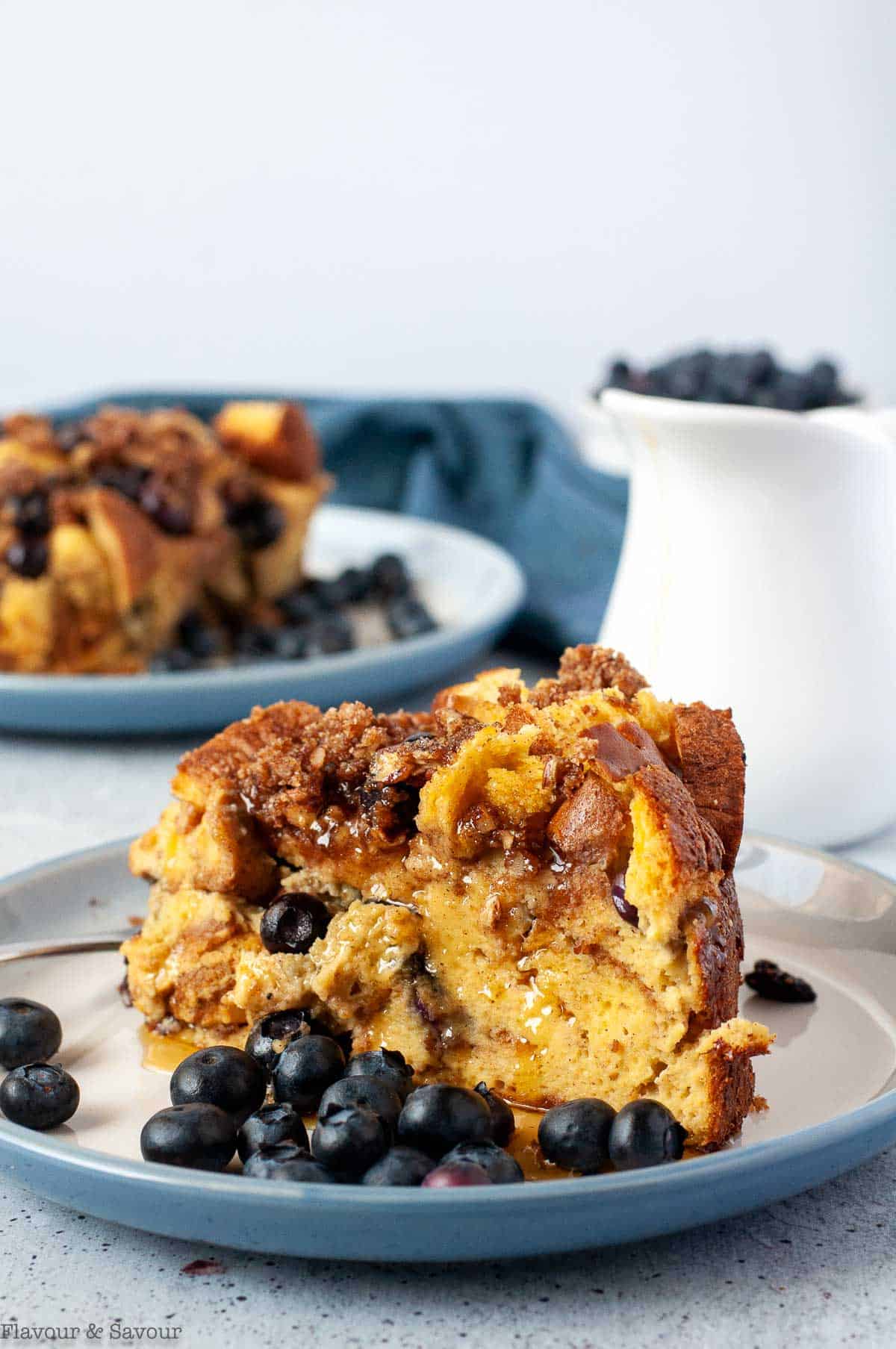 a serving of slow cooker blueberry French toast with fresh blueberries